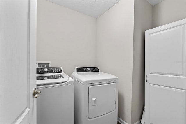 324 Palace Dr, Saint Augustine, FL 32084 - washroom with separate washer and dryer and a textured ceiling