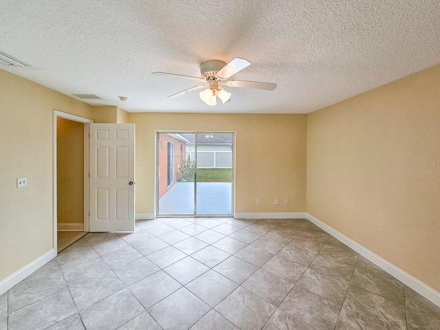 18 Wheatfield Dr, Palm Coast, FL 32164 - spare room featuring ceiling fan, light tile patterned flooring, baseboards, and a textured ceiling
