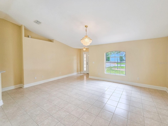 18 Wheatfield Dr, Palm Coast, FL 32164 - unfurnished room featuring light tile patterned floors, baseboards, and vaulted ceiling