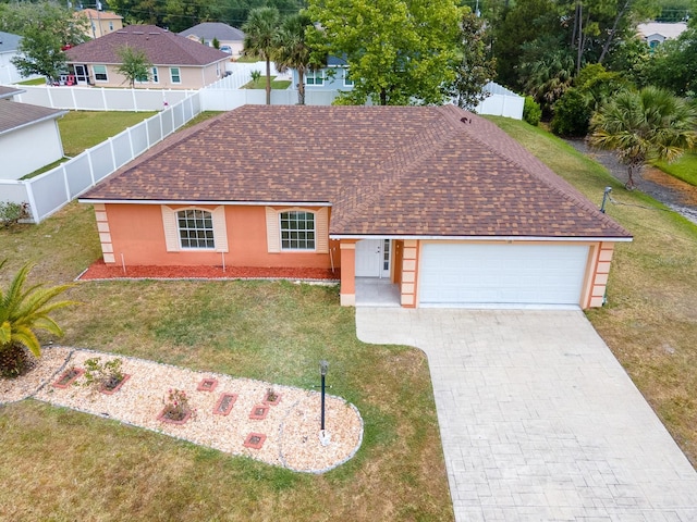 18 Wheatfield Dr, Palm Coast, FL 32164 - view of front of house with an attached garage, stucco siding, driveway, and a shingled roof