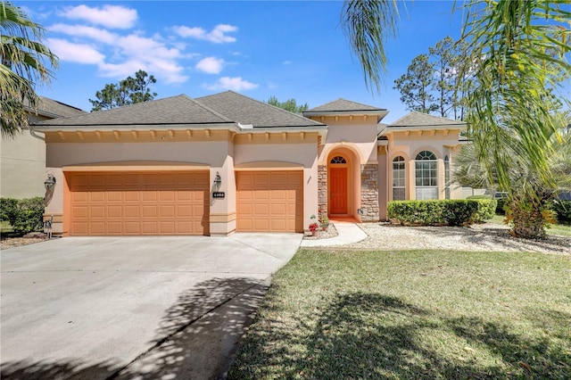 4484 Gray Hawk St, Orange Park, FL 32065 - view of front facade with a front lawn, driveway, stucco siding, and a garage
