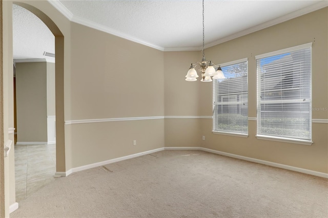 4484 Gray Hawk St, Orange Park, FL 32065 - spare room featuring an inviting chandelier, carpet floors, arched walkways, and crown molding