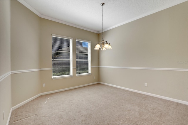 4484 Gray Hawk St, Orange Park, FL 32065 - carpeted spare room with crown molding, baseboards, and a chandelier