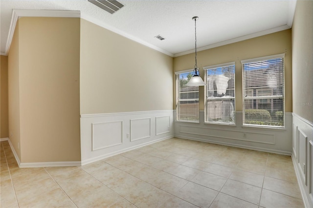 4484 Gray Hawk St, Orange Park, FL 32065 - unfurnished dining area featuring light tile patterned flooring, visible vents, crown molding, and a textured ceiling