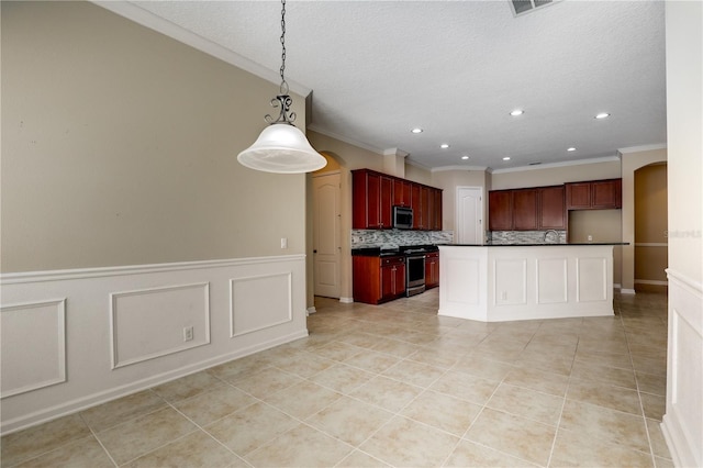 4484 Gray Hawk St, Orange Park, FL 32065 - kitchen with tasteful backsplash, stainless steel appliances, dark countertops, arched walkways, and dark brown cabinets