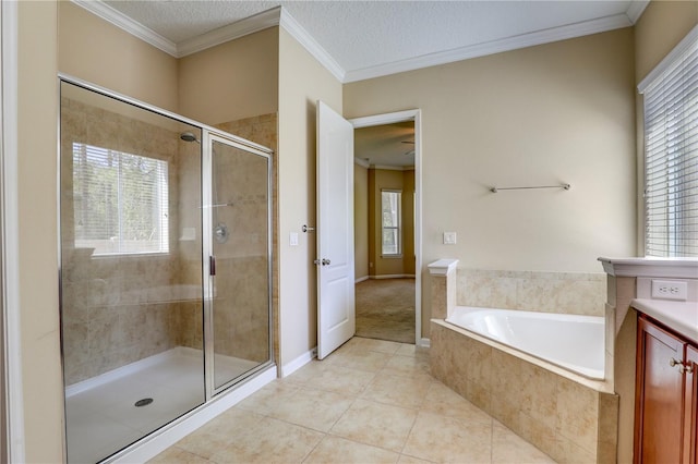 4484 Gray Hawk St, Orange Park, FL 32065 - bathroom with a stall shower, tile patterned floors, a textured ceiling, a bath, and ornamental molding