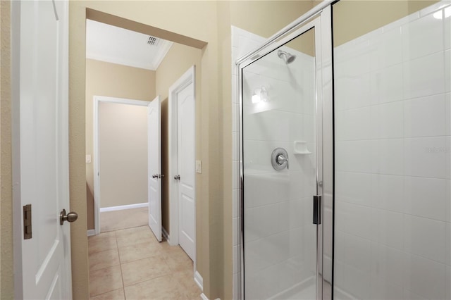 4484 Gray Hawk St, Orange Park, FL 32065 - bathroom featuring tile patterned flooring, visible vents, a stall shower, and crown molding