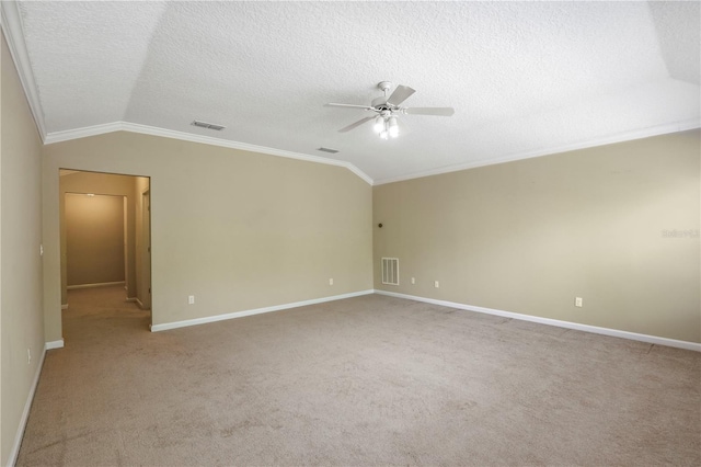 4484 Gray Hawk St, Orange Park, FL 32065 - unfurnished room with crown molding, lofted ceiling, a textured ceiling, visible vents, and a ceiling fan