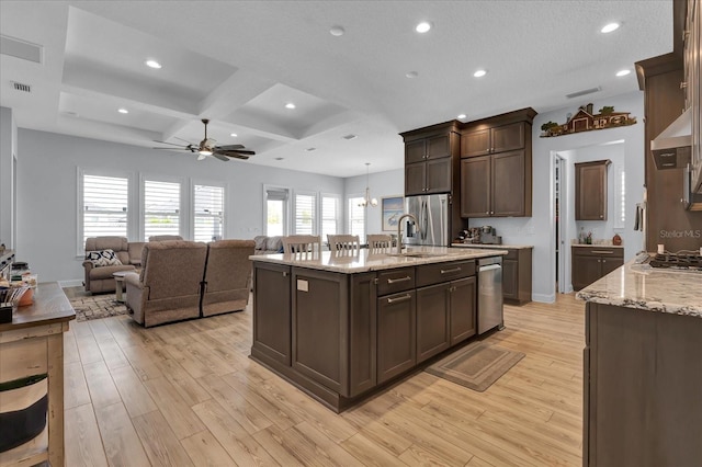 kitchen featuring stainless steel fridge, a sink, ceiling fan, light wood-style floors, and coffered ceiling