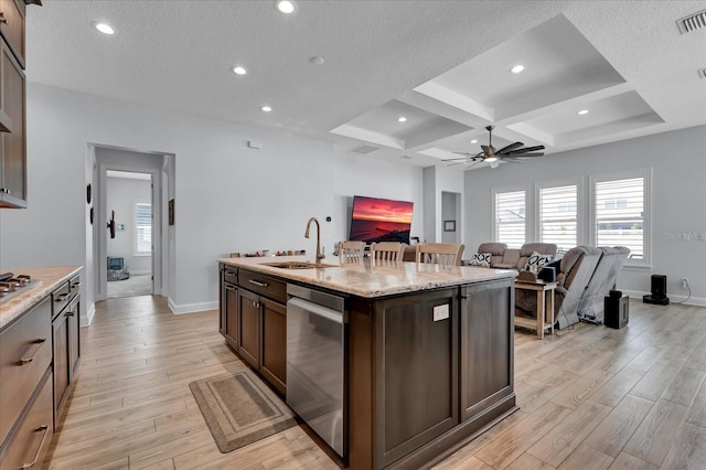 kitchen featuring a sink, ceiling fan, dark brown cabinetry, light wood-style flooring, and coffered ceiling