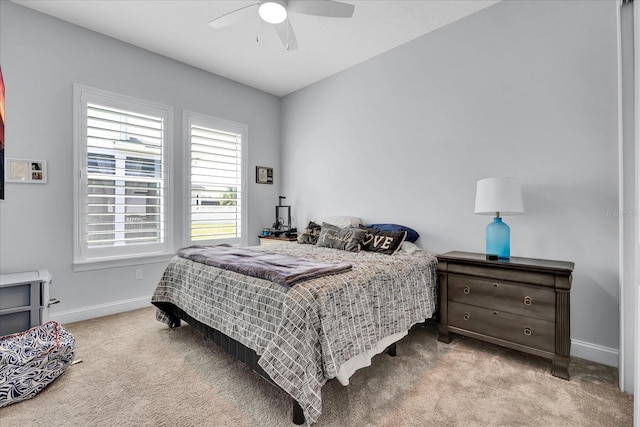 bedroom featuring carpet flooring, baseboards, and ceiling fan