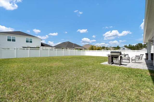 view of yard with a patio area and a fenced backyard