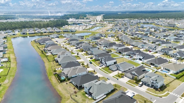 aerial view featuring a residential view and a water view