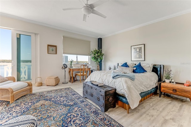 925 N Halifax Ave Unit 1105, Daytona Beach, FL 32118 - bedroom with light wood finished floors, ceiling fan, and crown molding