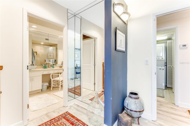 925 N Halifax Ave Unit 1105, Daytona Beach, FL 32118 - hallway featuring baseboards and light wood-style flooring