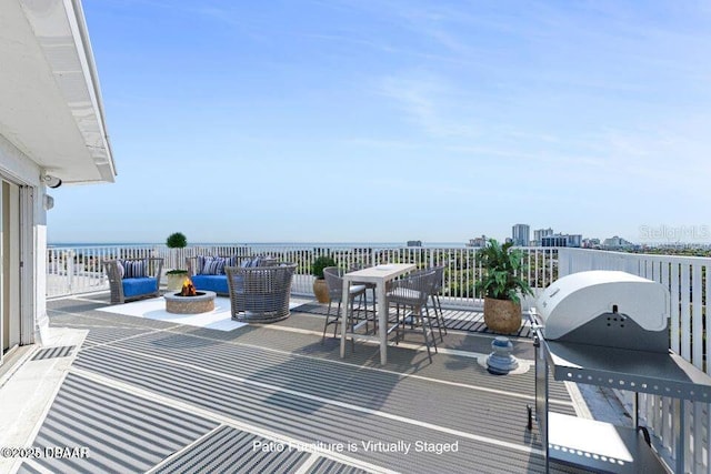 925 N Halifax Ave Unit 1105, Daytona Beach, FL 32118 - view of patio featuring a fire pit and outdoor dining area