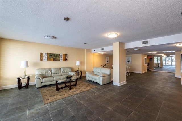 925 N Halifax Ave Unit 1105, Daytona Beach, FL 32118 - living area featuring baseboards, visible vents, and a textured ceiling