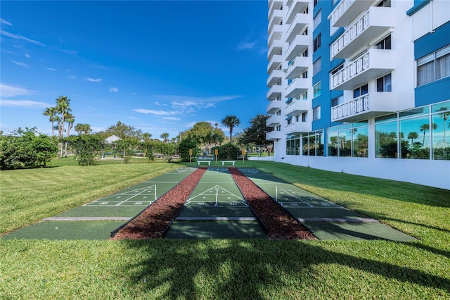 925 N Halifax Ave Unit 1105, Daytona Beach, FL 32118 - view of home's community featuring a lawn and shuffleboard