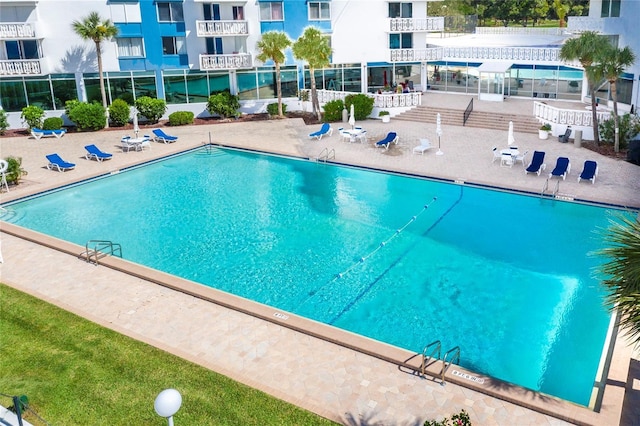 925 N Halifax Ave Unit 1105, Daytona Beach, FL 32118 - community pool featuring a patio area
