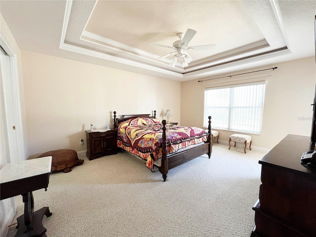 161 Frontier Dr, Palm Coast, FL 32137 - carpeted bedroom with a textured ceiling, a tray ceiling, and baseboards