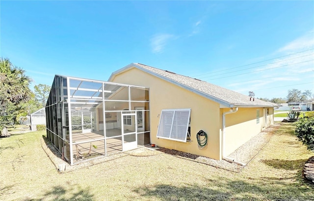 161 Frontier Dr, Palm Coast, FL 32137 - rear view of property featuring stucco siding, a shingled roof, a patio, and a lanai