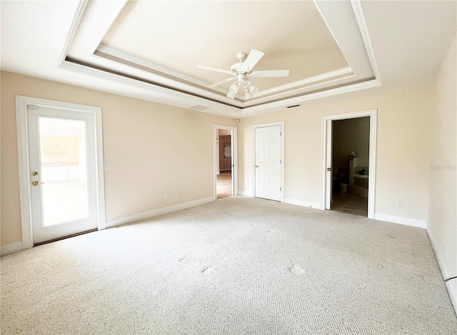161 Frontier Dr, Palm Coast, FL 32137 - unfurnished bedroom featuring a raised ceiling, light colored carpet, connected bathroom, baseboards, and ornamental molding