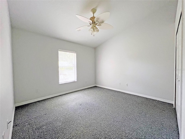 161 Frontier Dr, Palm Coast, FL 32137 - unfurnished room featuring carpet flooring, ceiling fan, vaulted ceiling, and baseboards
