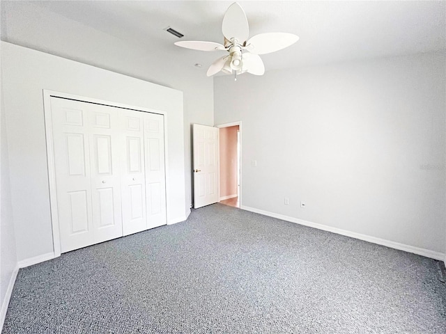 161 Frontier Dr, Palm Coast, FL 32137 - unfurnished bedroom with baseboards, a closet, a ceiling fan, and carpet