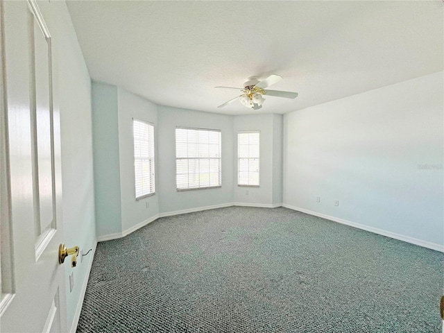 161 Frontier Dr, Palm Coast, FL 32137 - spare room featuring ceiling fan, carpet flooring, healthy amount of natural light, and baseboards