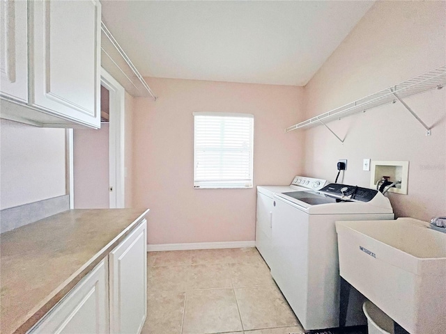 161 Frontier Dr, Palm Coast, FL 32137 - laundry area with cabinet space, washer and dryer, light tile patterned flooring, and baseboards