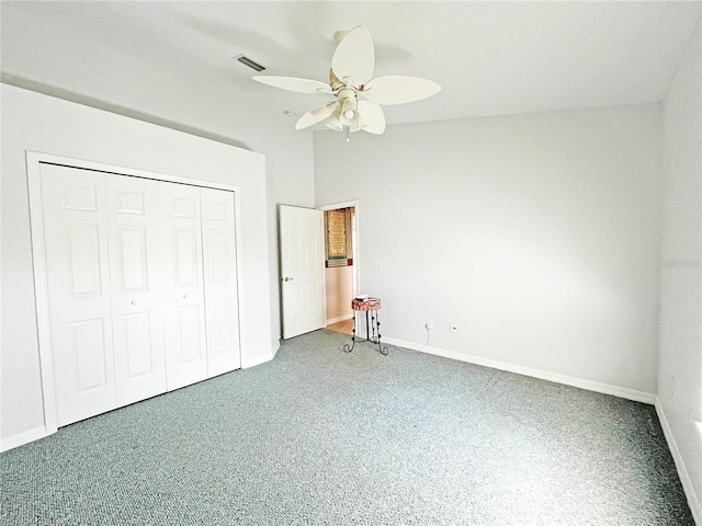 161 Frontier Dr, Palm Coast, FL 32137 - unfurnished bedroom with carpet, baseboards, a closet, and ceiling fan