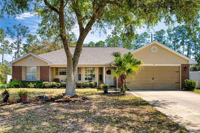 73 Royal Oak Dr, Palm Coast, FL 32164 - ranch-style house featuring driveway, brick siding, a shingled roof, and an attached garage