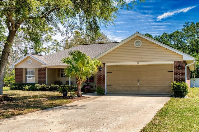 73 Royal Oak Dr, Palm Coast, FL 32164 - single story home with driveway, brick siding, and an attached garage