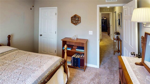 73 Royal Oak Dr, Palm Coast, FL 32164 - bedroom featuring carpet floors, baseboards, and visible vents
