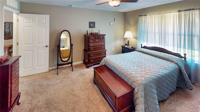 73 Royal Oak Dr, Palm Coast, FL 32164 - bedroom with baseboards, a textured ceiling, ceiling fan, and light colored carpet