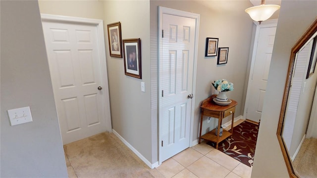 73 Royal Oak Dr, Palm Coast, FL 32164 - hall with light tile patterned floors and baseboards