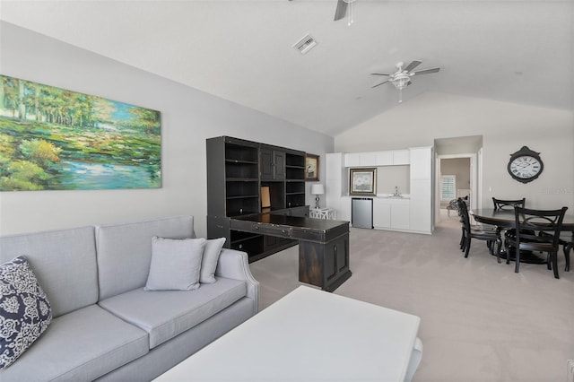 46 Ocean Ridge Blvd N, Palm Coast, FL 32137 - living area with ceiling fan, light colored carpet, and high vaulted ceiling