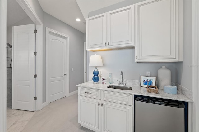 46 Ocean Ridge Blvd N, Palm Coast, FL 32137 - kitchen with dishwasher, a sink, white cabinets, light stone counters, and recessed lighting