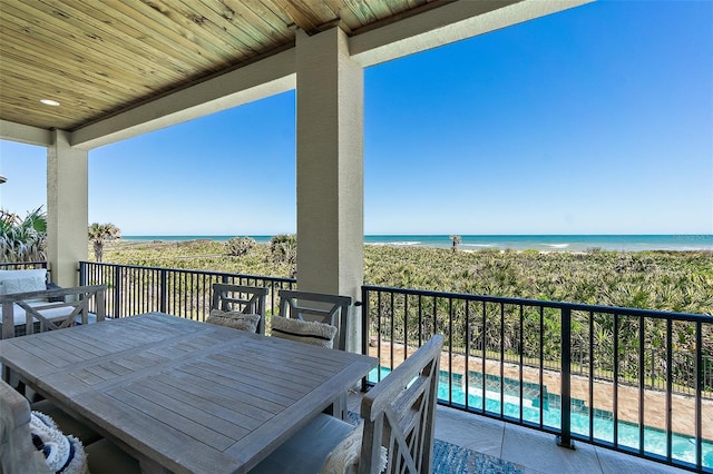 46 Ocean Ridge Blvd N, Palm Coast, FL 32137 - balcony with outdoor dining area, view of water and beach, and view of pool area