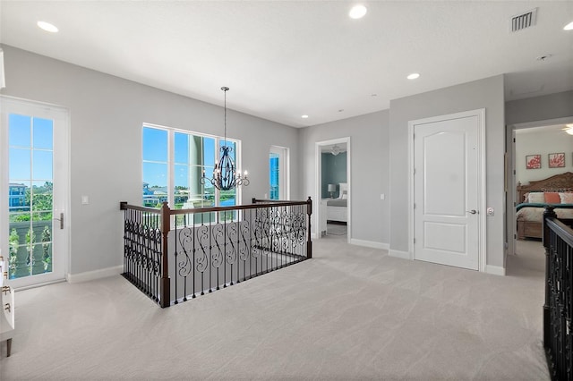 46 Ocean Ridge Blvd N, Palm Coast, FL 32137 - bedroom with carpet flooring, baseboards, a chandelier, recessed lighting, and access to outside