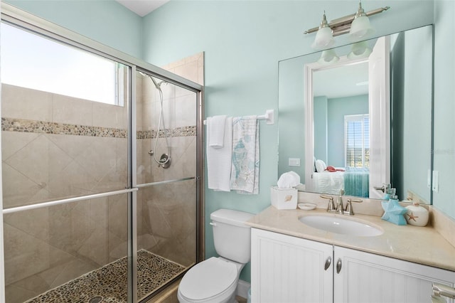 46 Ocean Ridge Blvd N, Palm Coast, FL 32137 - full bathroom featuring vanity, a stall shower, toilet, and ensuite bathroom