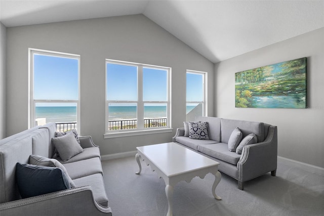 46 Ocean Ridge Blvd N, Palm Coast, FL 32137 - living area with carpet flooring, vaulted ceiling, baseboards, and a water view