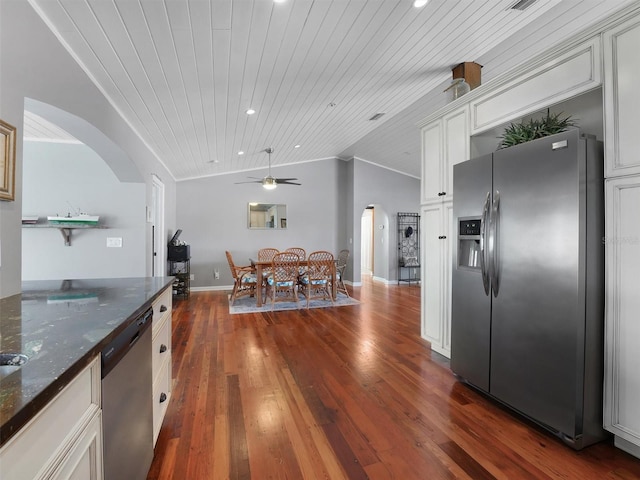 kitchen featuring a ceiling fan, wooden ceiling, arched walkways, vaulted ceiling, and stainless steel appliances