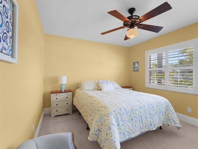 bedroom featuring baseboards, carpet, and a ceiling fan