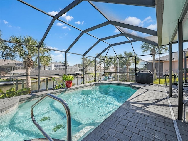 pool featuring a residential view, a patio, and a lanai