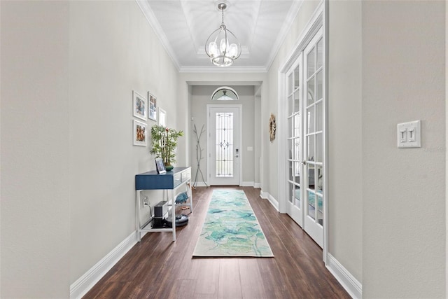 7 Menorca Way, Palm Coast, FL 32137 - entryway with ornamental molding, dark wood-style flooring, baseboards, a chandelier, and french doors