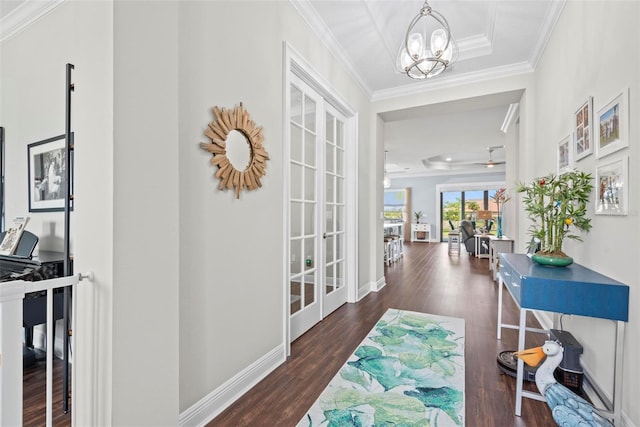 7 Menorca Way, Palm Coast, FL 32137 - hall with crown molding, french doors, a chandelier, and wood finished floors