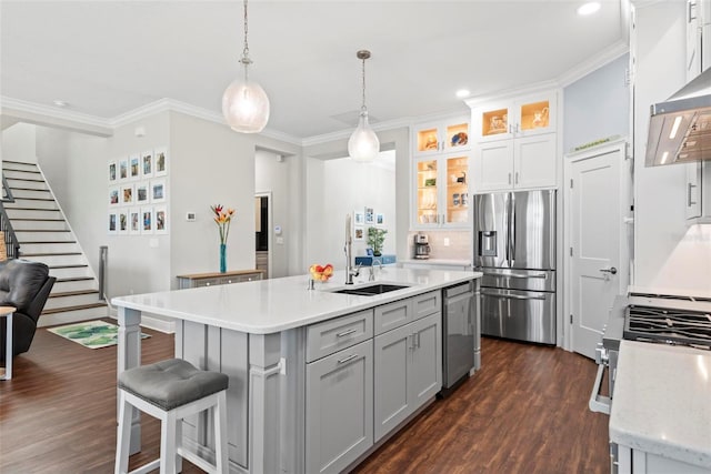 7 Menorca Way, Palm Coast, FL 32137 - kitchen featuring crown molding, a sink, dark wood-style flooring, and appliances with stainless steel finishes