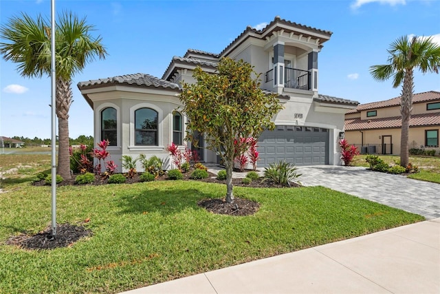 7 Menorca Way, Palm Coast, FL 32137 - mediterranean / spanish-style home with an attached garage, a front lawn, stucco siding, and a tile roof