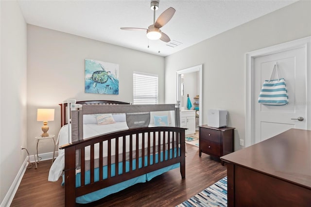 7 Menorca Way, Palm Coast, FL 32137 - bedroom featuring baseboards, a ceiling fan, ensuite bathroom, and wood finished floors